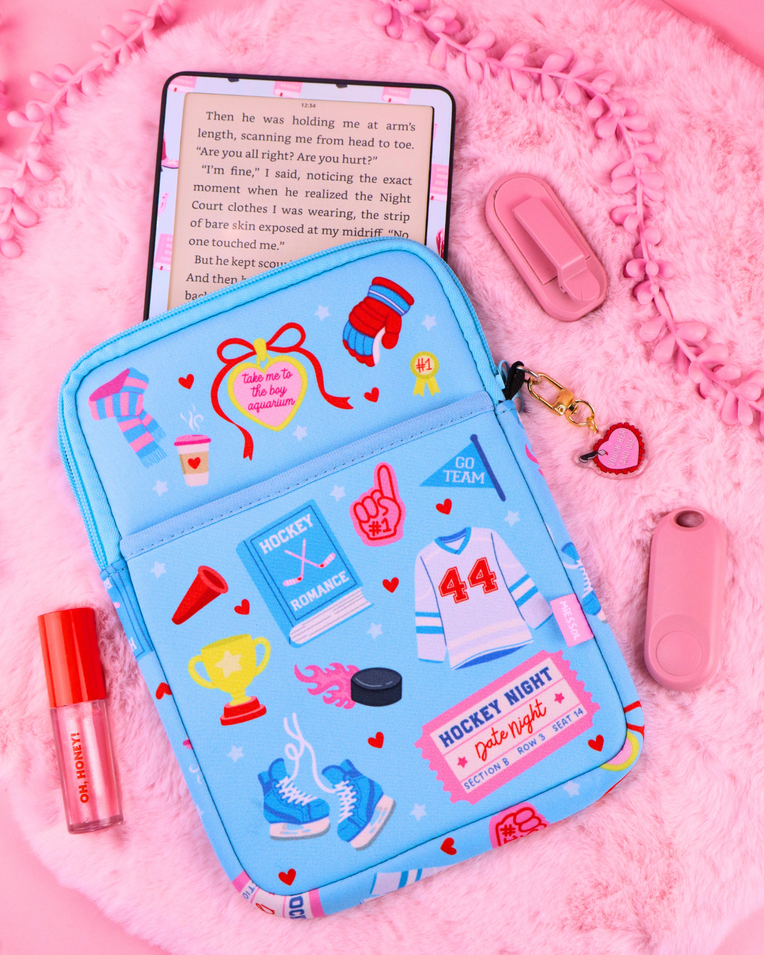 Hockey romance neoprene e-reader and book sleeve for Kindle, Kobo and books, with padded interior, zipper closure and charm ring.