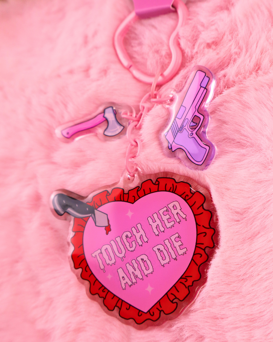 Pink Touch Her and Die dark romance keychain with heart-shaped hardware and three bookish charms, perfect for bags, keys and book sleeves.