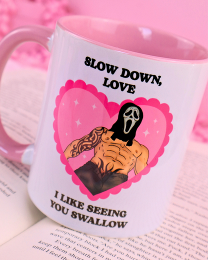 Masked men mug with the quote “Slow down, I like seeing you swallow”